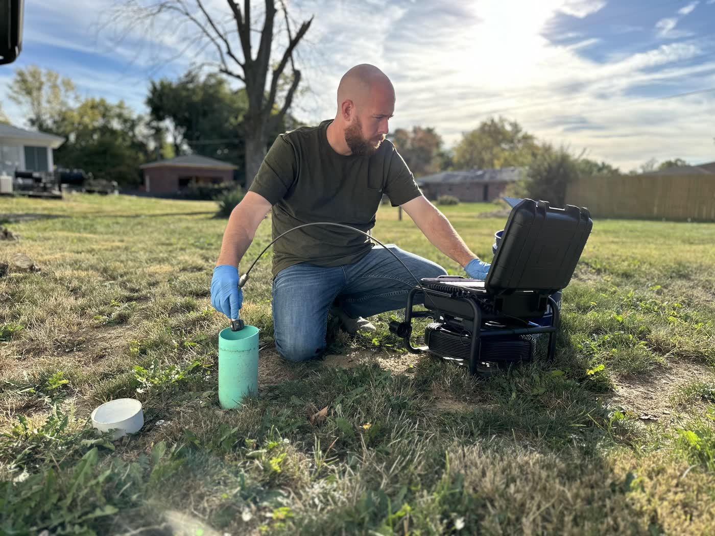 Opening the access cleanout at a Fort Wayne residential sewer scope.